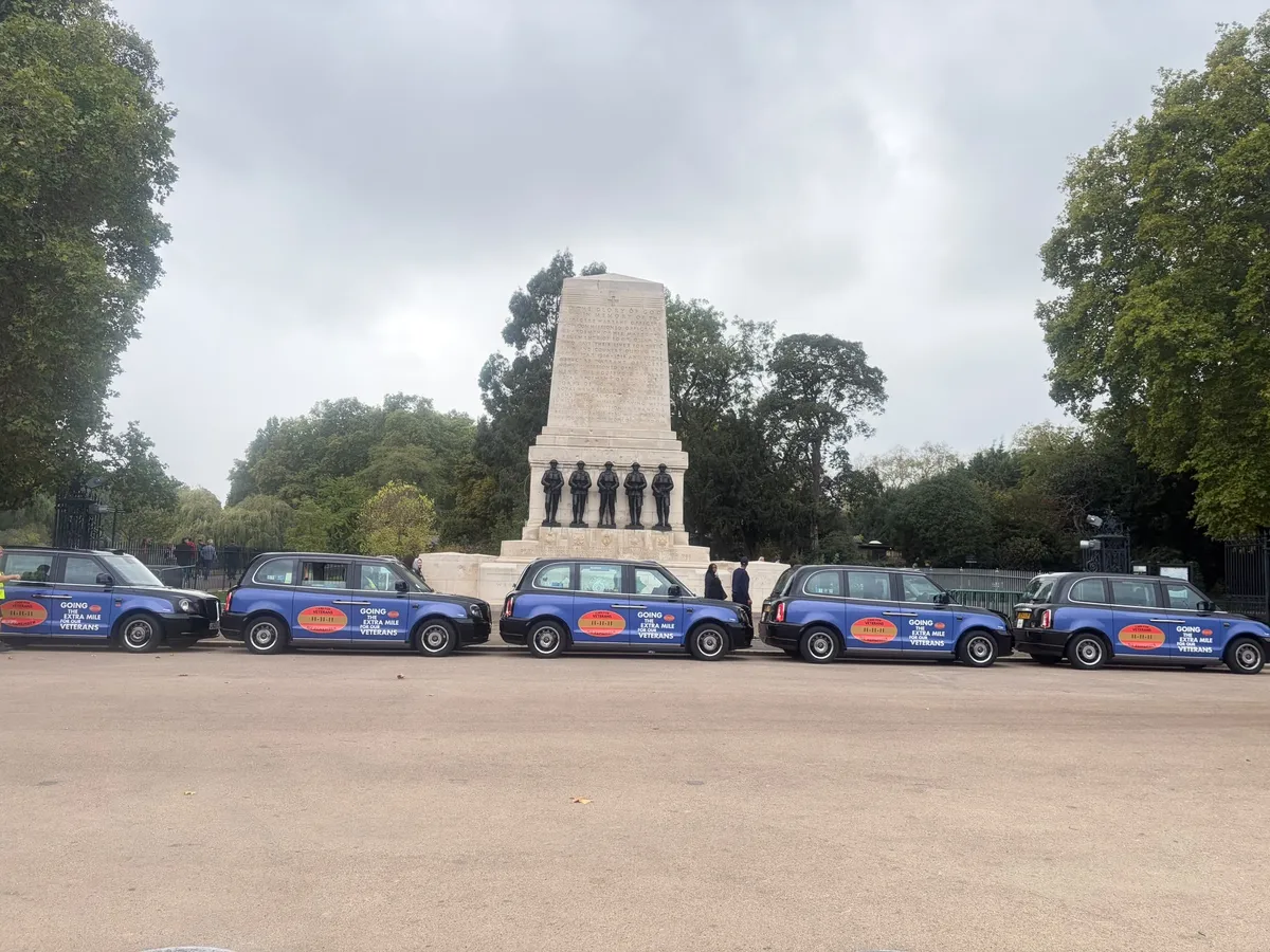 5 liveried taxis at Horse Guards Road
